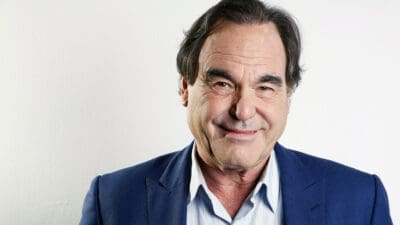 In this Wednesday, Nov. 14, 2012, photo, American film director, screenwriter and producer Oliver Stone poses for a portrait in New York. Oliver Stone has never been shy about ruffling feathers with his take real-life events. From “J.F.K” and “Nixon,” to “Salvador” and “W,” Stone has challenged the history that we know by incorporating a revisionist view. His latest project, “The Untold History of the United States," a ten-part series, currently on the premium Showtime network, explores the facts he feels were suppressed for one reason or another. (Photo by Carlo Allegri/Invision/AP)